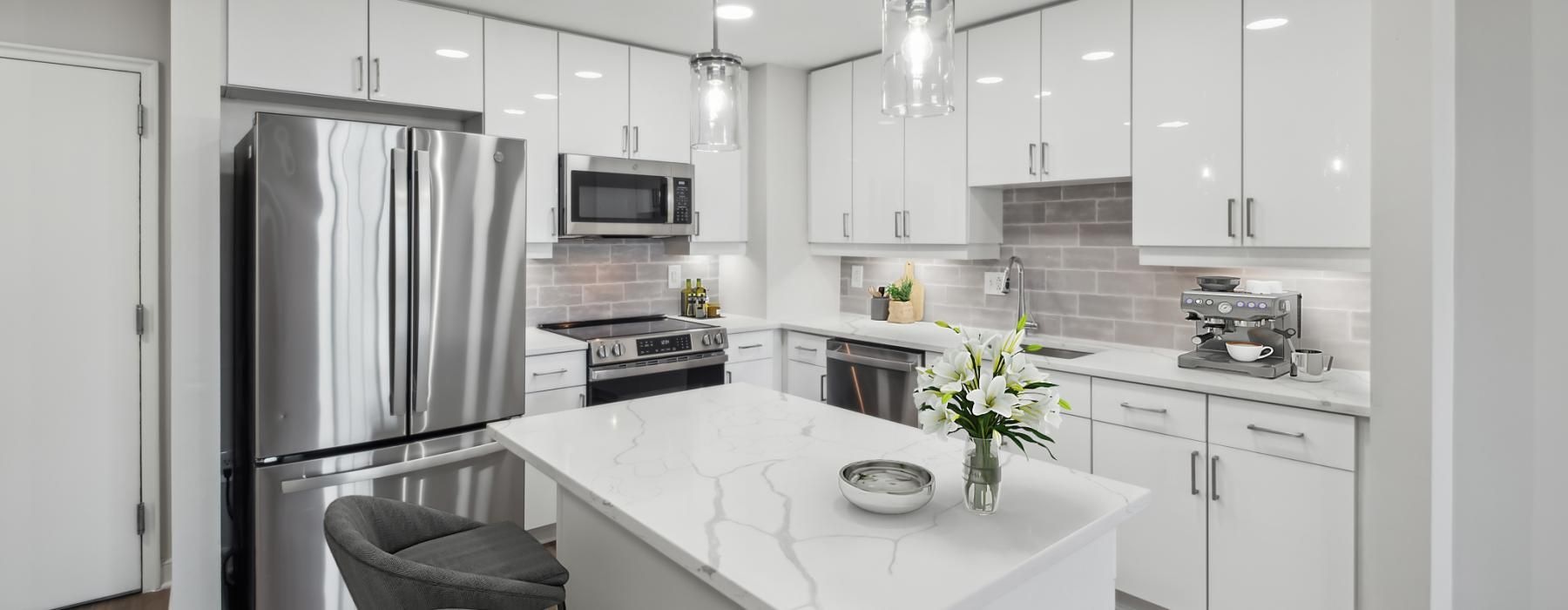 a kitchen with white cabinets