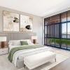 a bedroom with a bed and two nightstands
