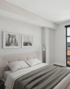 a bedroom with a large glass door