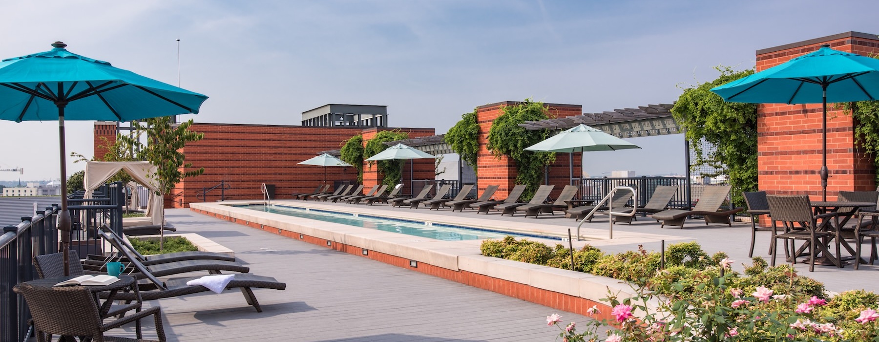 a pool with chairs and umbrellas