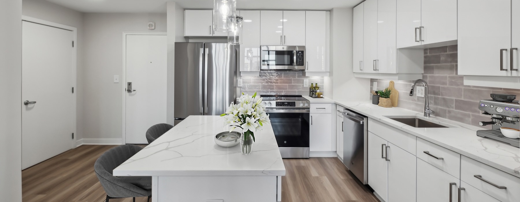 a kitchen with white cabinets