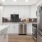 a kitchen with white cabinets