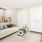 a living room with a white couch and a tv
