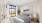 a bedroom with a bed and two nightstands