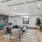 a clubroom with a couch, chairs and a table