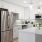 a kitchen with white cabinets