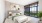 a bedroom with a bed and two nightstands