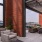 a patio area with tables and chairs