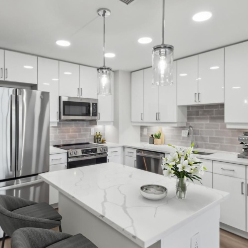 a kitchen with white cabinets