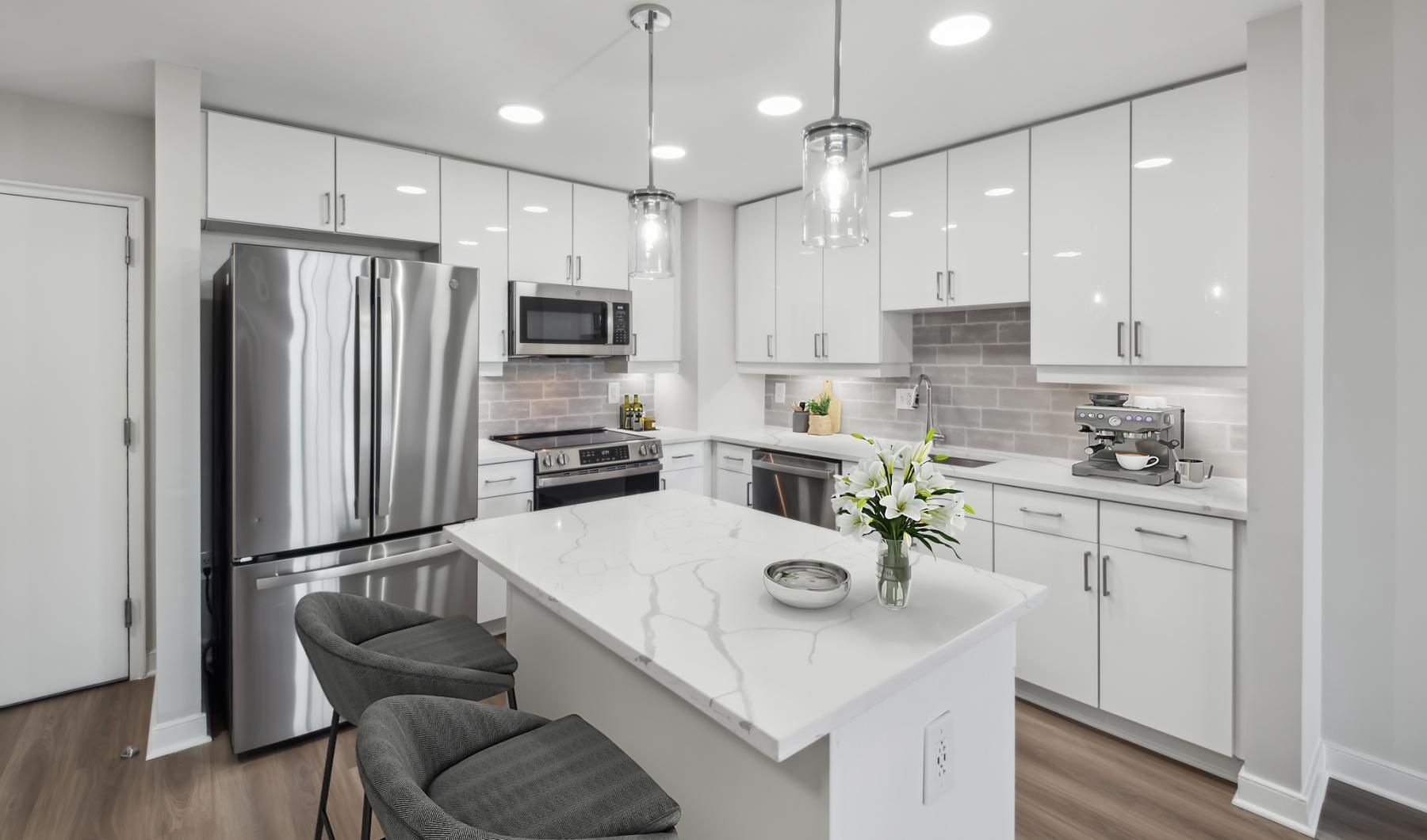 a kitchen with white cabinets